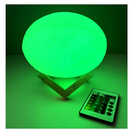 Lampe led lune 16 couleurs décorative avec télécommande sur table.  