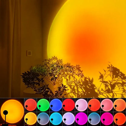 Projecteur LED coucher de soleil RGB avec 16 couleurs, créant un large halo lumineux chaleureux sur le mur. Idéal pour ambiance déco et prises de vue.